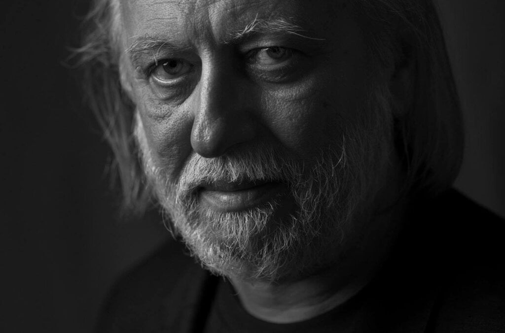 A black-and-white portrait of a man