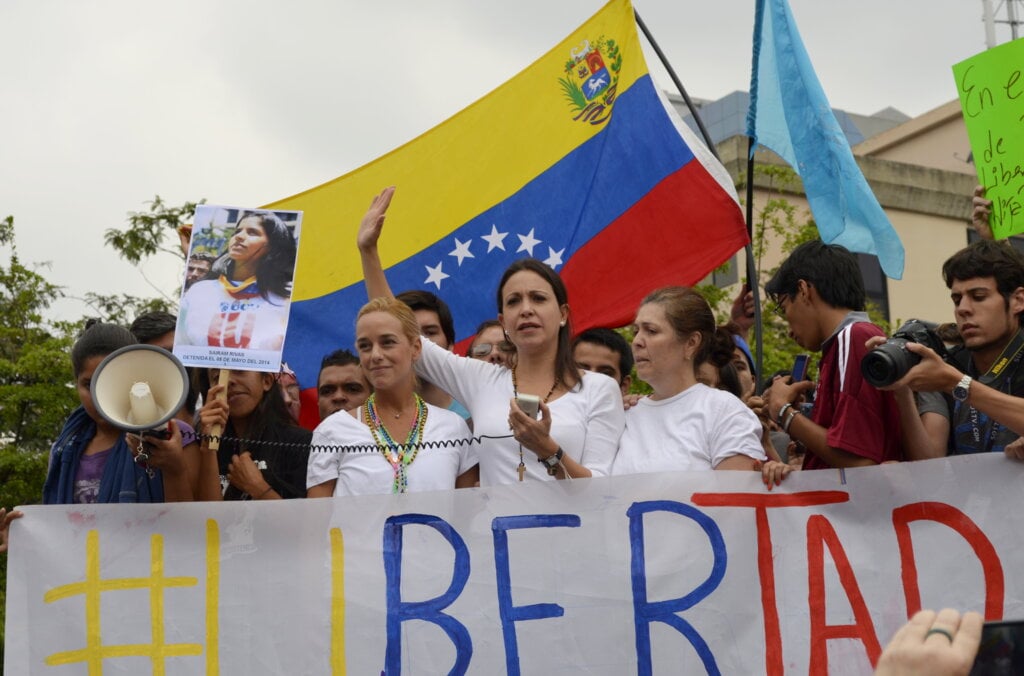 Photo of two women leading a march