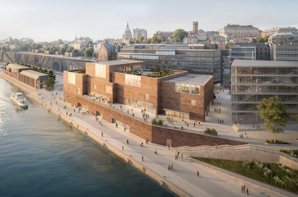 Vy längs strandlinjen mot vattnet.