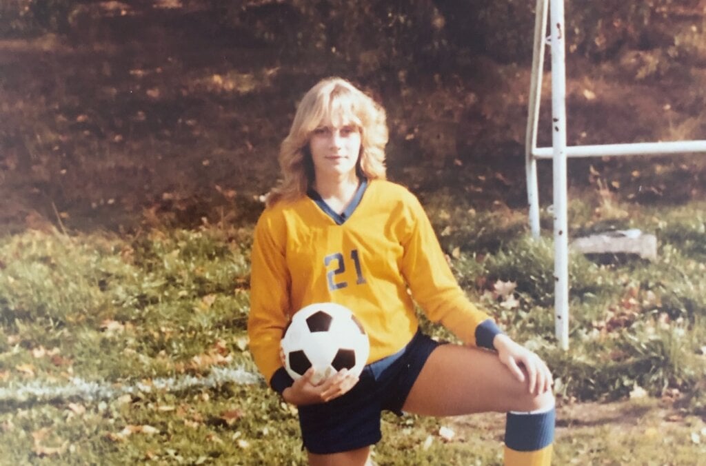 Young woman posing in soccer wear