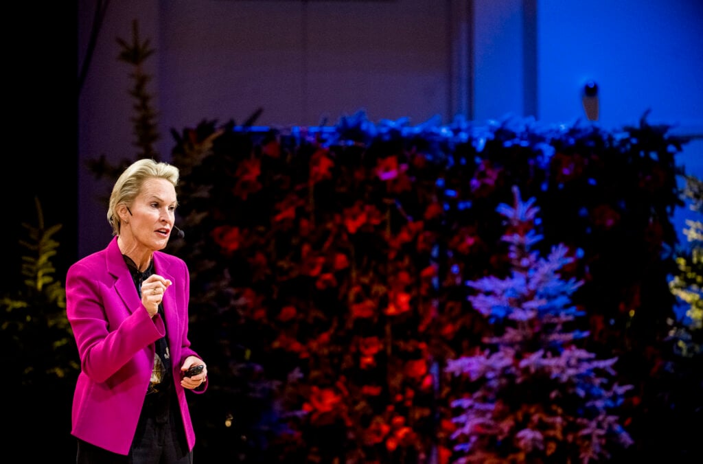 A woman delivering her lecture