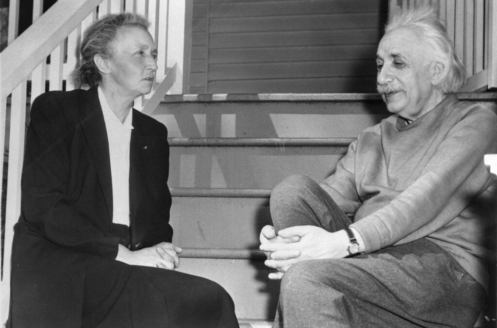 A woman and man sitting on the stairs