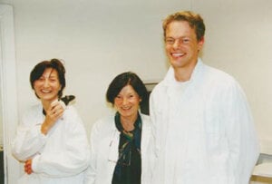 Two women and a man in a laboratory