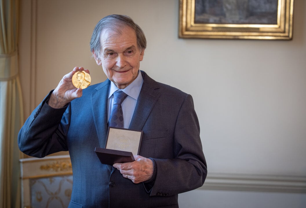 Roger Penrose receiving his Nobel Prize medal and diploma