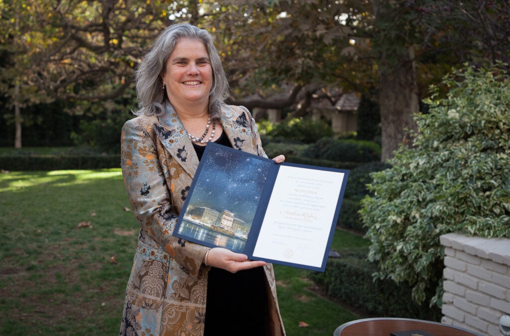 Andrea Ghez receiving her Nobel Prize diploma