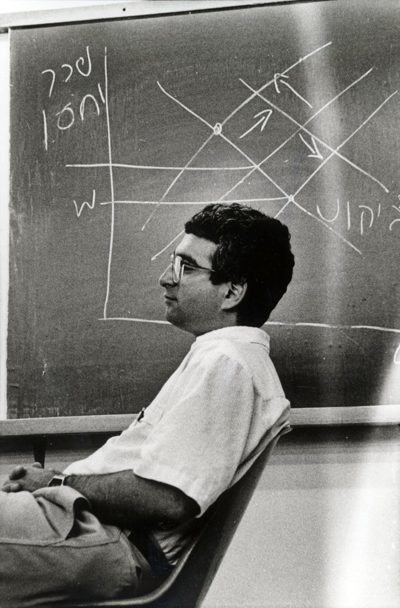 Joshua Angrist in the 1990s in front of a blackboard