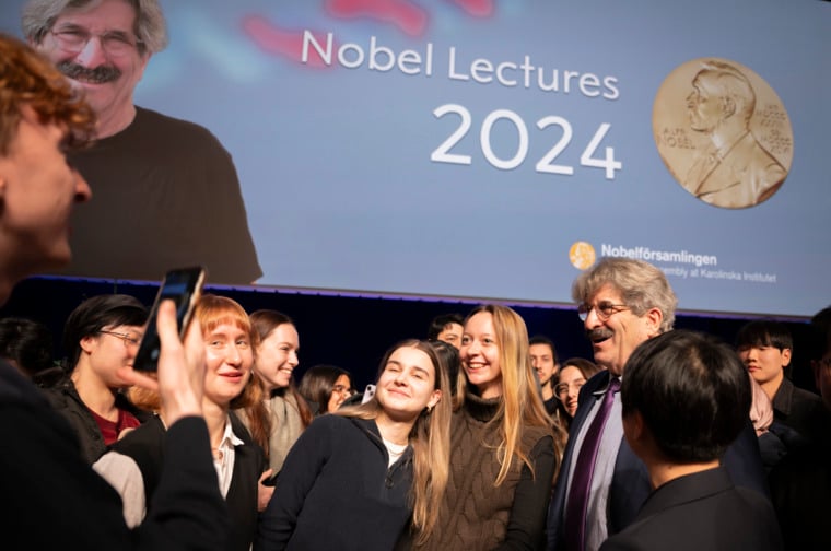 A man talking to students