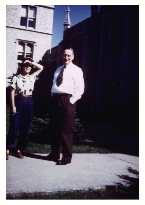 A woman and a man outside a building