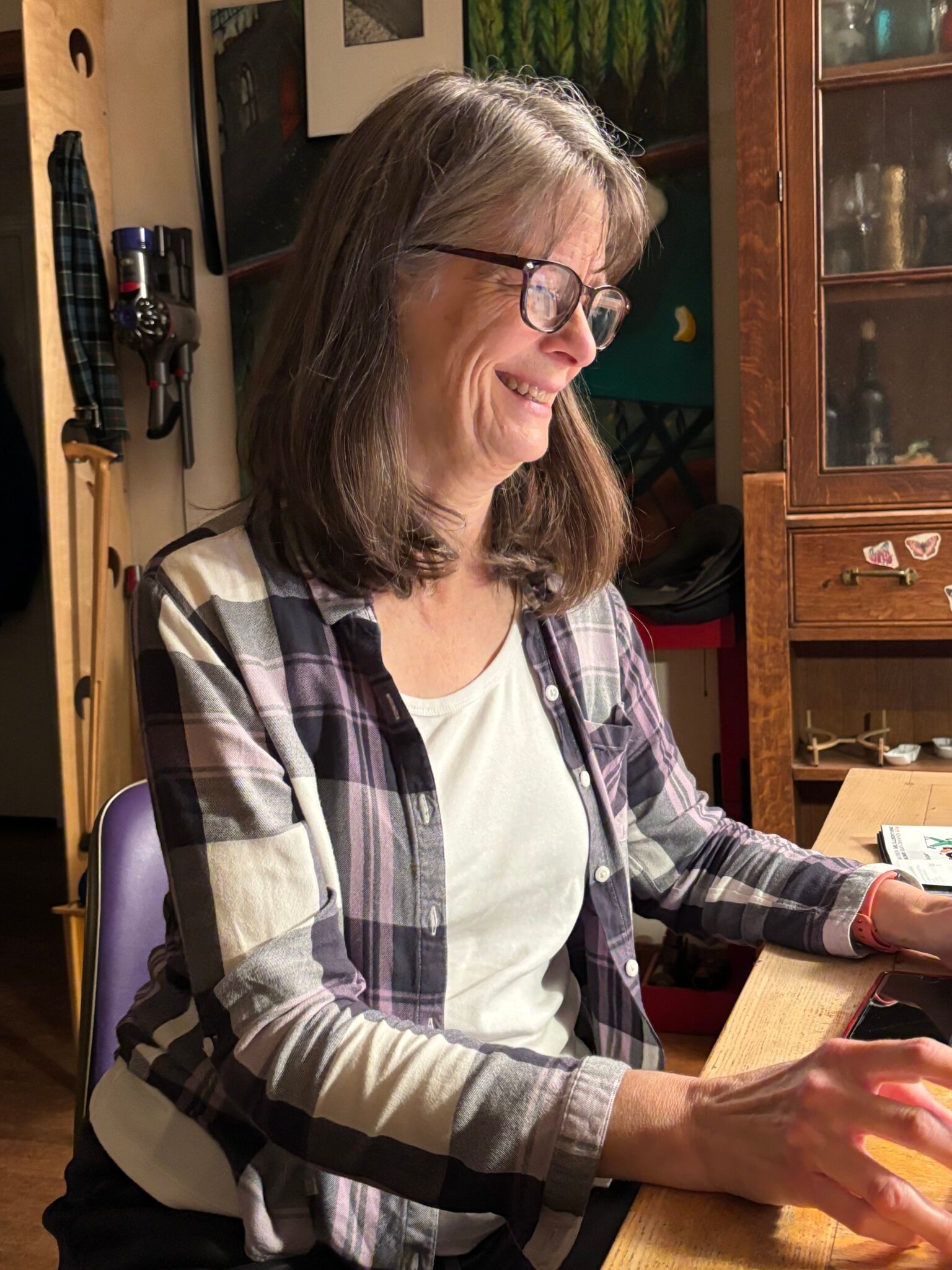 A woman sitting at a dining table