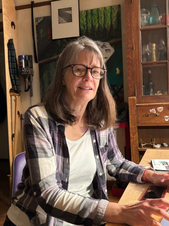 A woman sitting at a dining table
