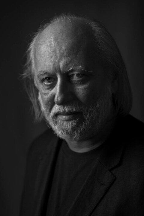 A black-and-white portrait of a man