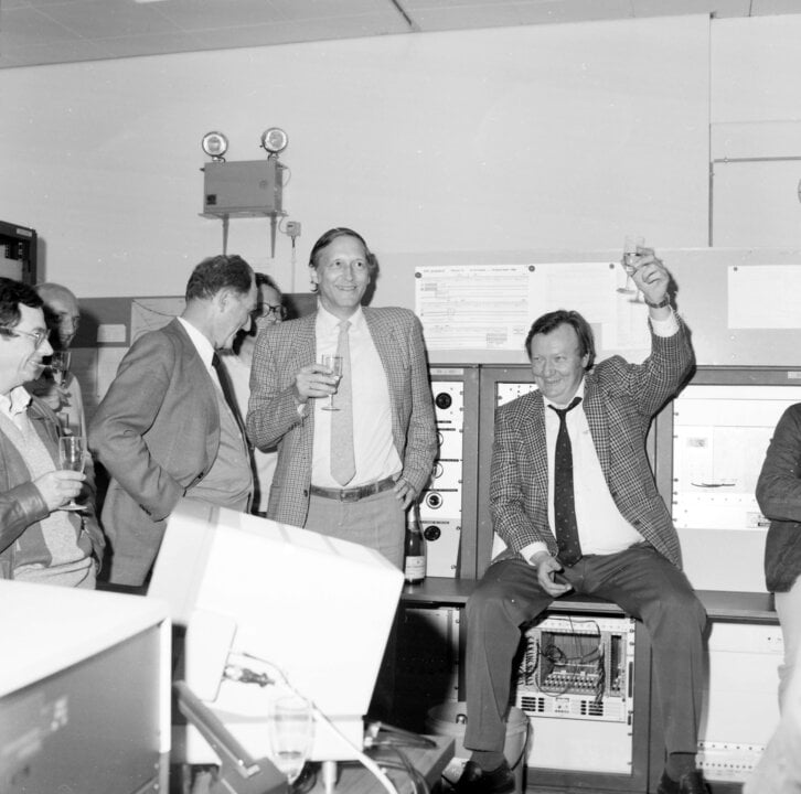 Three men celebrating