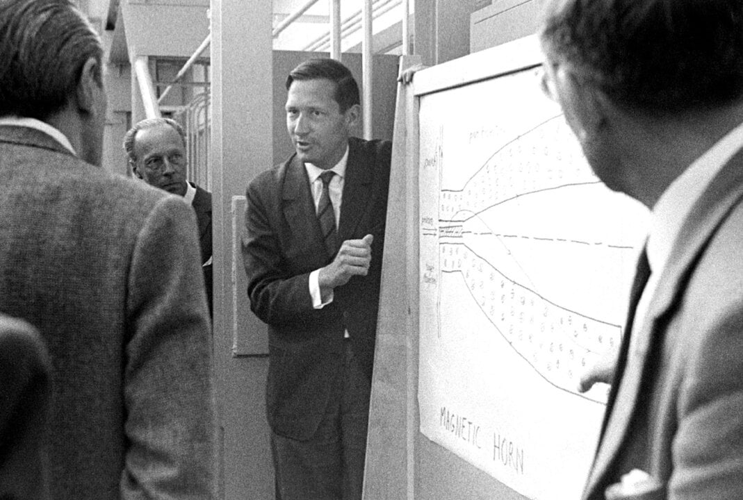 A man in front of a whiteboard