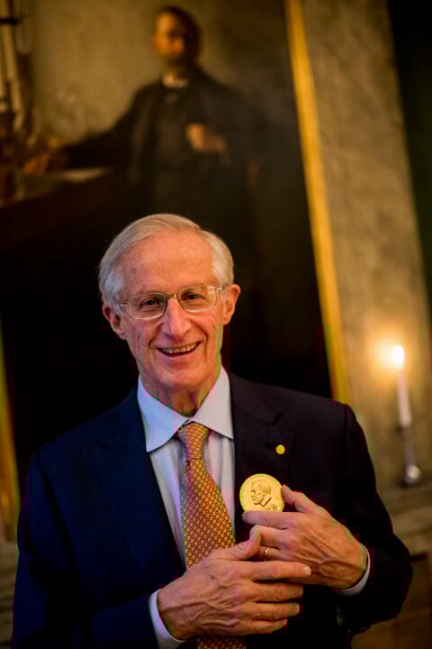A man showing his medal