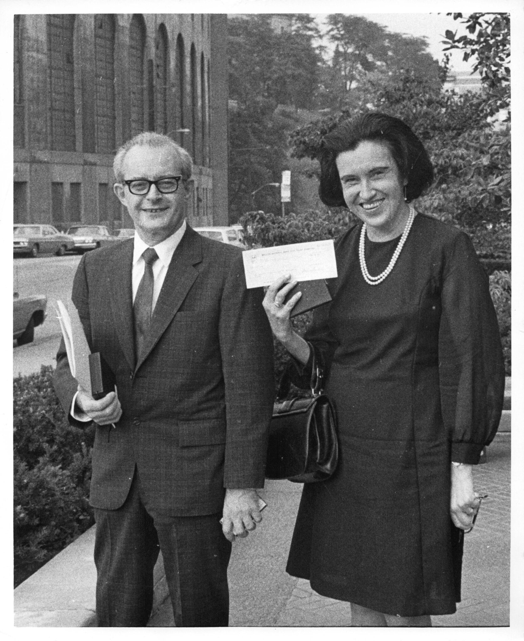 A man and a woman standing in the street