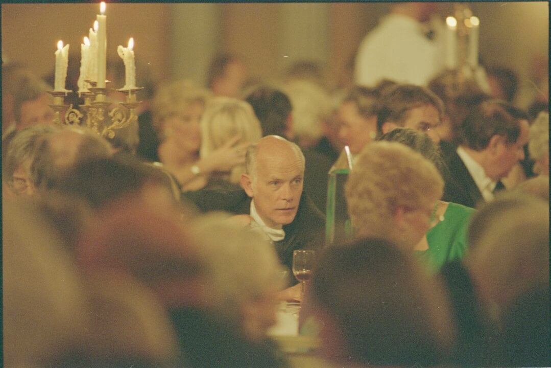 A man at a banquet table