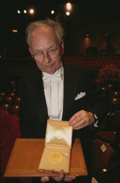 A man showing his medal
