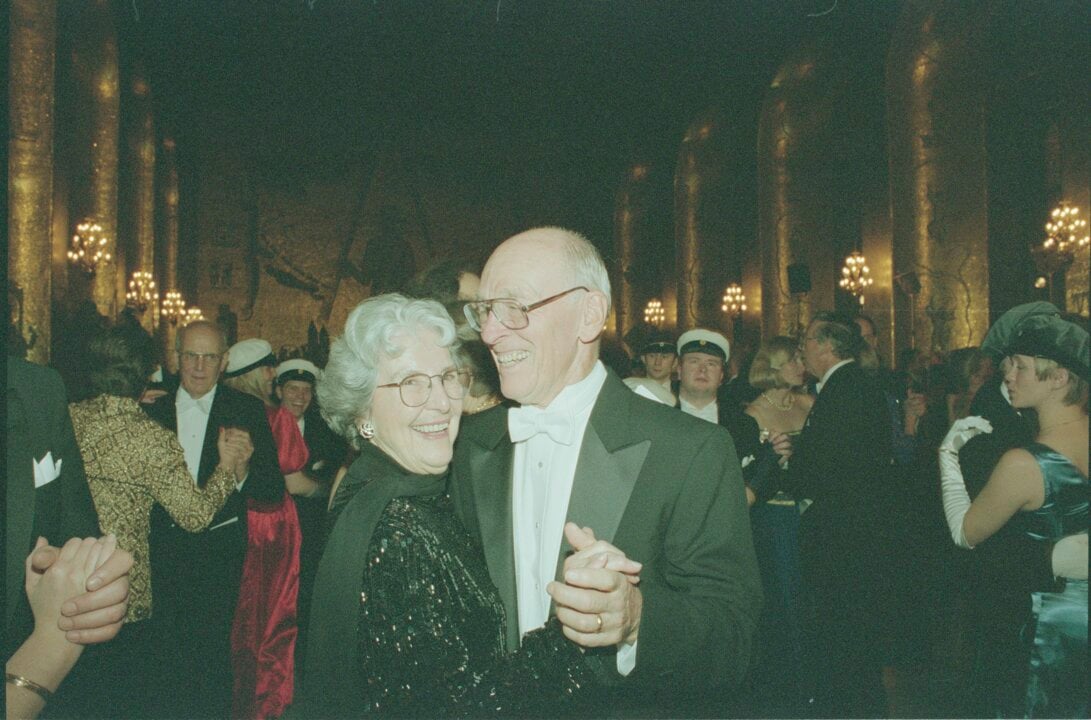 Paul D. Boyer dances at banquet