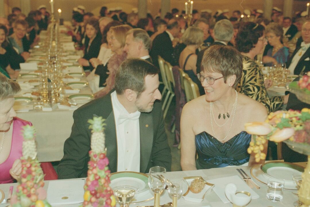 A man and a woman at a banquet table