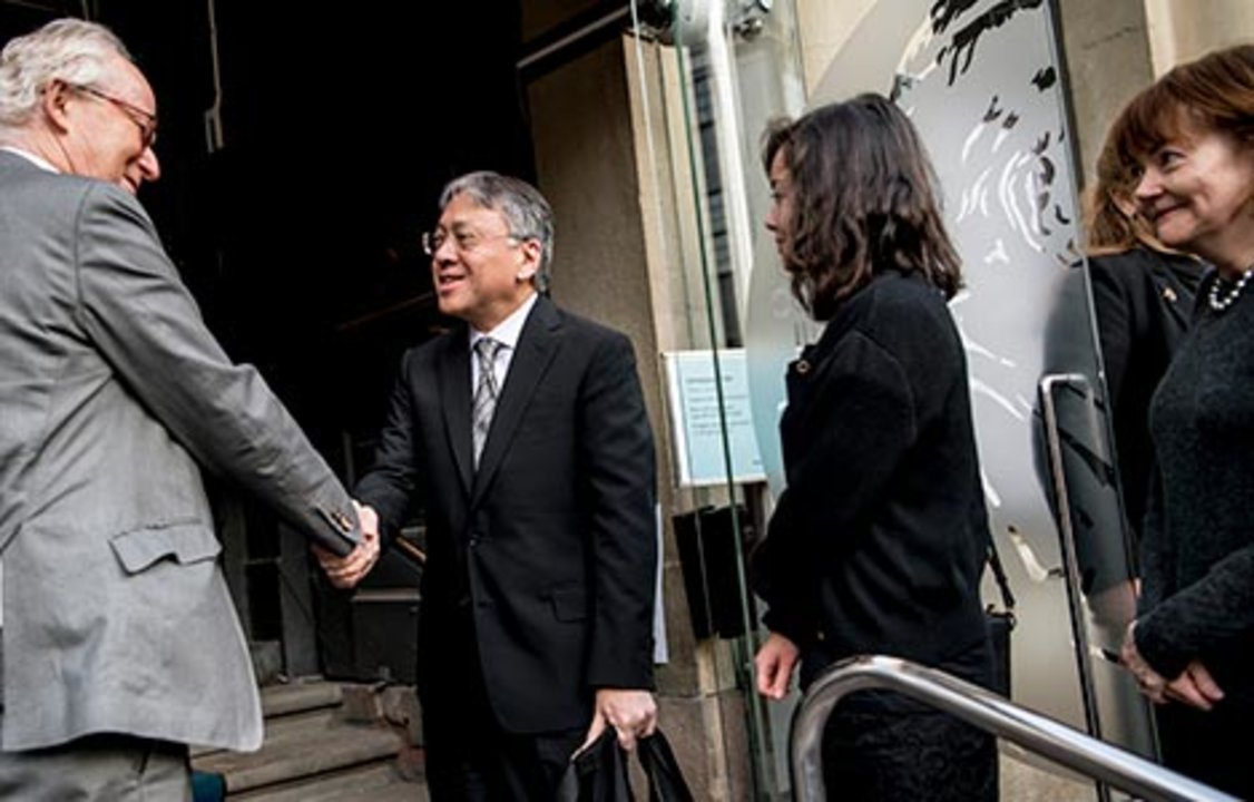 Kazuo Ishiguro receives a hearty handshake from Lars Heikensten