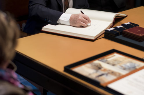 Arthur B. McDonald signs the Nobel Foundation's guest book, signed by the Laureates since 1952, during his visit to the Nobel Foundation on 12 December 2015.