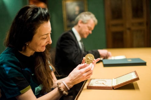 May-Britt and Edvard I. Moser examining their Nobel Medals during their visit to the Nobel Foundation, on 12 December 2014.