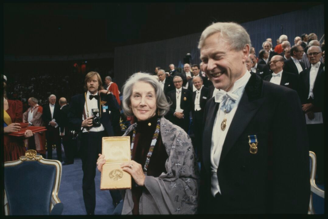 A woman showing her medal