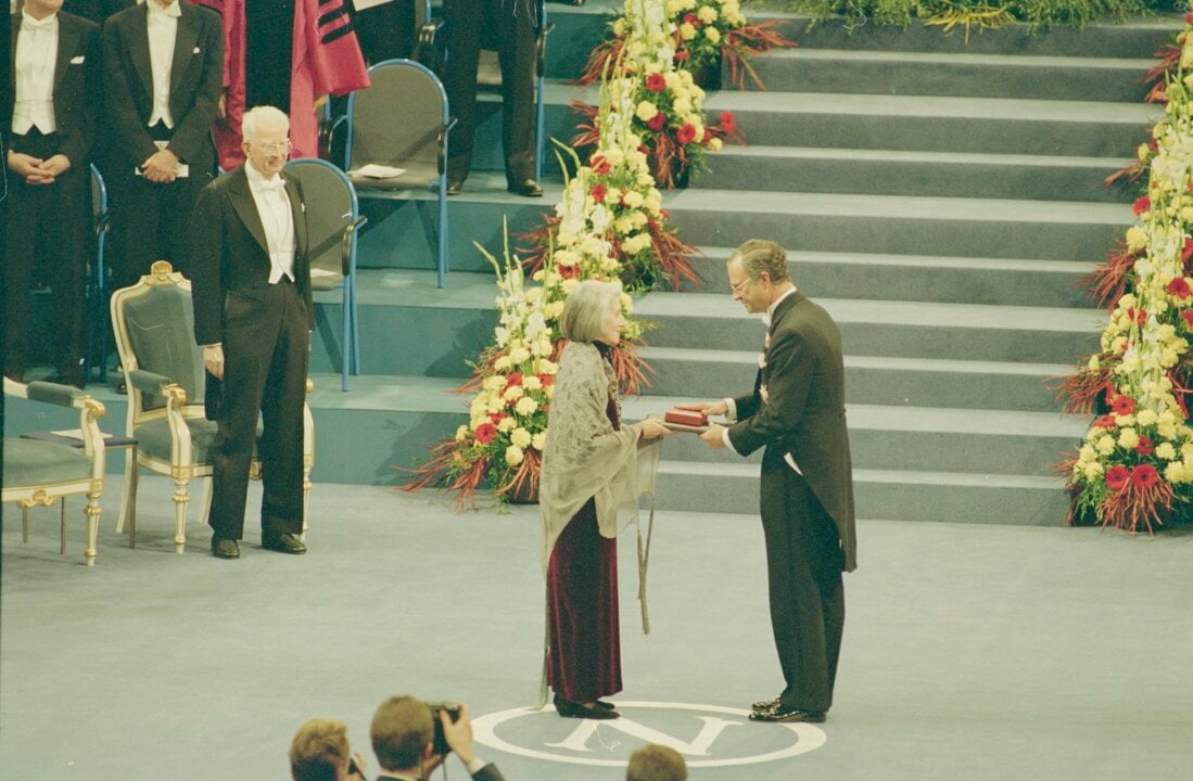 A man handing over a prize to a woman