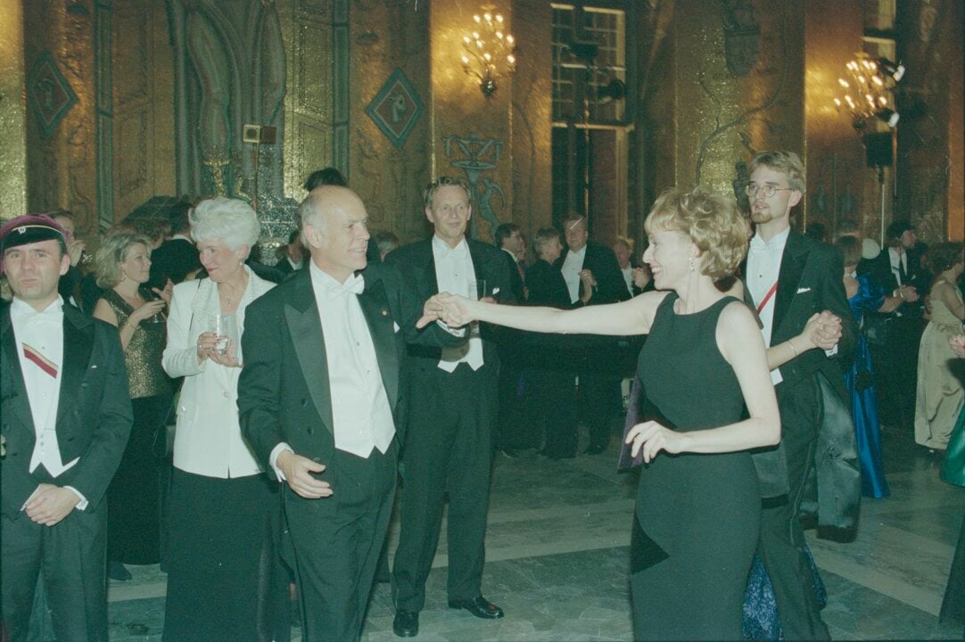 A man and a woman dancing at a banquet