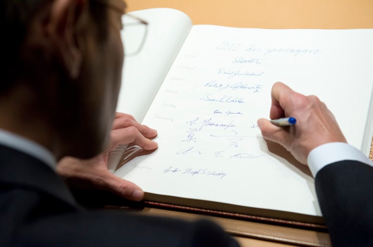 Shinya Yamanaka visits the Nobel Foundation on 12 December 2012 and signs the guest book
