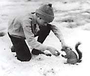 Boy and squirrel.