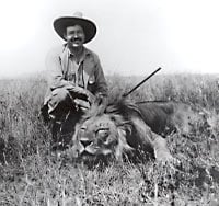 Ernest Hemingway with a lion.