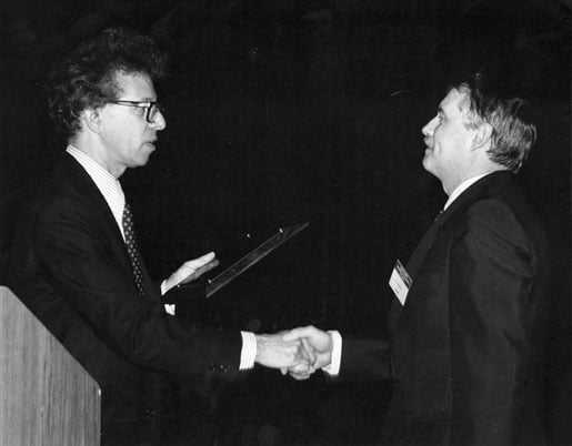 Receiving an award plate of the American Society of Pathology.