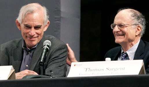 Princeton University economist Christopher Sims (left) enjoys a laugh during a news conference with his co-Laureate Thomas Sargent