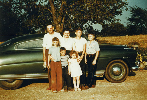 I am standing next to my father and mother who are on my right and my brother Dick, on my left. In the front are Mary, Bill and Sally (left to right), in about 1952.