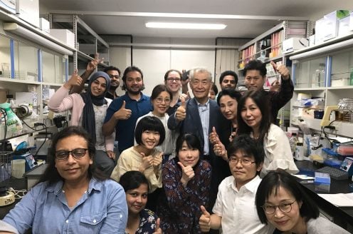 Nobel Prize laureate Tasuku Honjo, surrounded by his team at Kyoto University