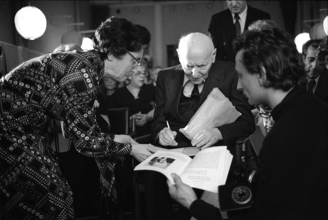 Isaac Bashevis Singer signing autographs