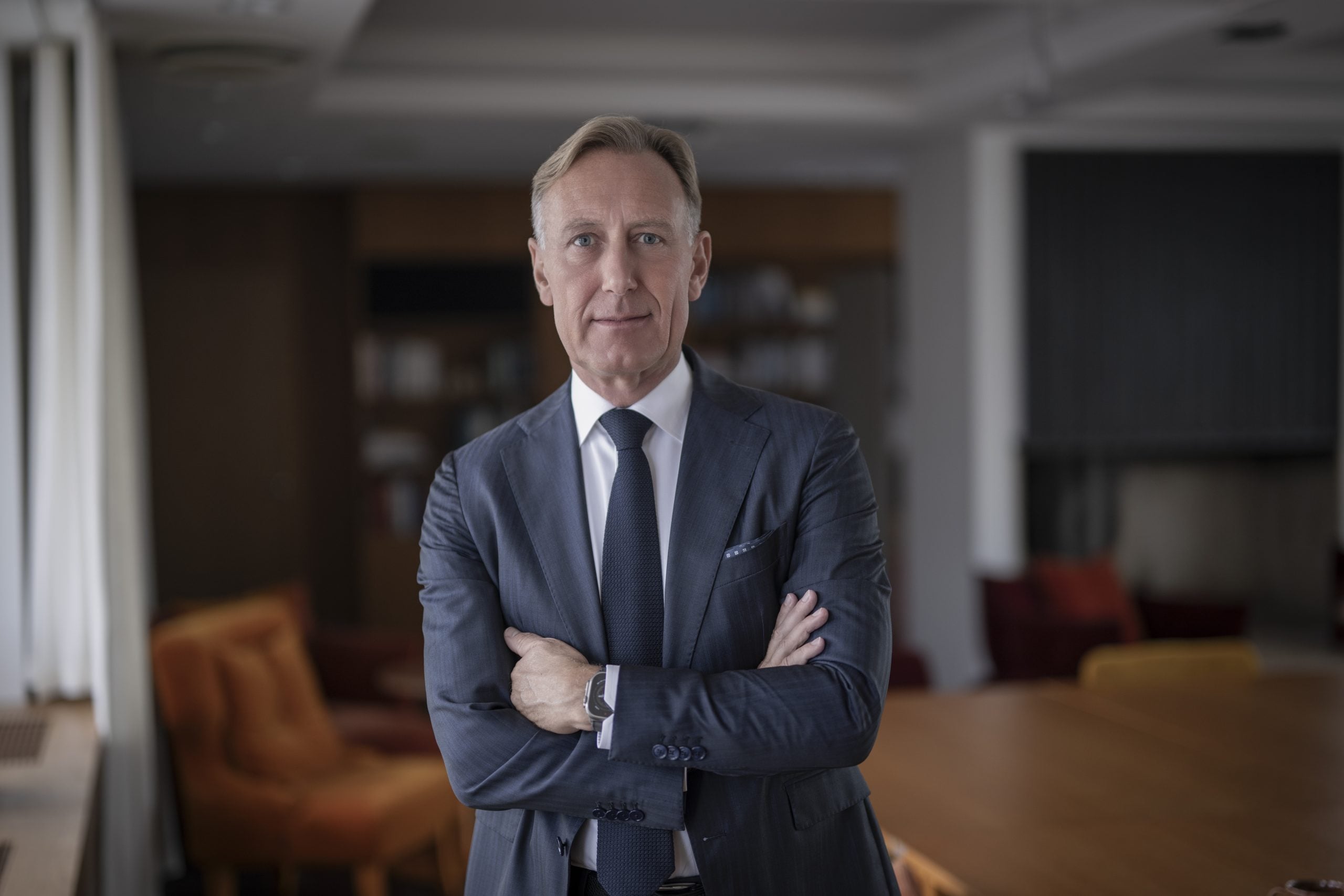 Man in suit with arms crossed